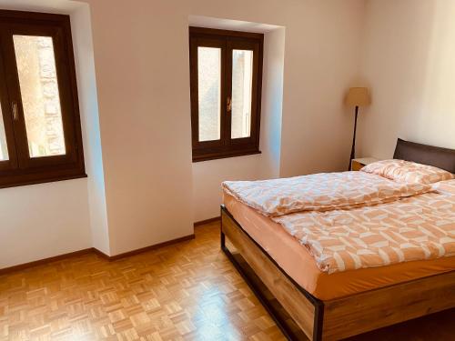 Ein Bett oder Betten in einem Zimmer der Unterkunft Appartamento Soldini