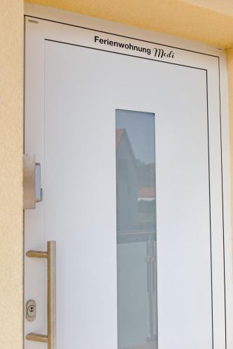 a door with a sign on top of it at Ferienwohnung Modi in Gamlitz