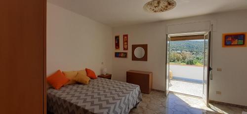 En eller flere senge i et værelse på Villa Maria