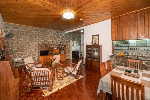 a kitchen and dining room with a table and chairs at Janes' Serenity Guesthouse in Anse a La Mouche