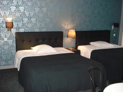 
A bed or beds in a room at Hotel La Fayette
