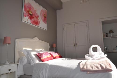 a bedroom with a bed with a towel on it at La Maison du Prince de Condé in Charroux-dʼAllier