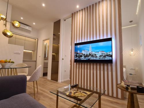 Een TV en/of entertainmentcenter bij Sospiro apartments
