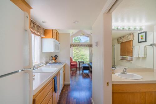 a kitchen with two sinks and a dining room at Strawhouse Resorts in Big Bar