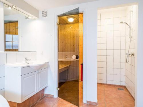 a bathroom with a shower and a sink at 6 person holiday home in Blåvand in Blåvand