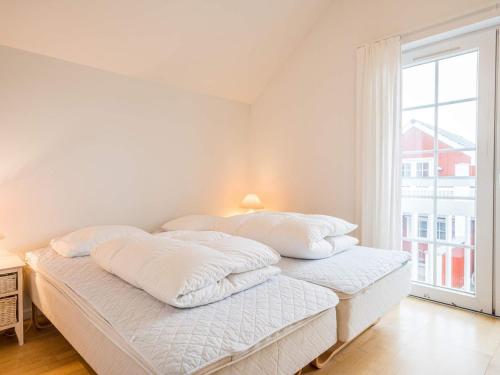 Łóżko lub łóżka w pokoju w obiekcie Holiday home Blåvand CLXVIII