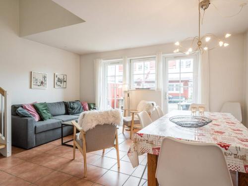 a living room with a table and a couch at 6 person holiday home in Blåvand in Blåvand