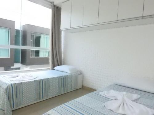 En eller flere senger på et rom på apartamento 2 quartos em Porto segur BA