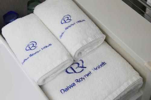 a group of towels sitting in a drawer at DEL style Ikebukuro Higashiguchi by Daiwa Roynet Hotel in Tokyo