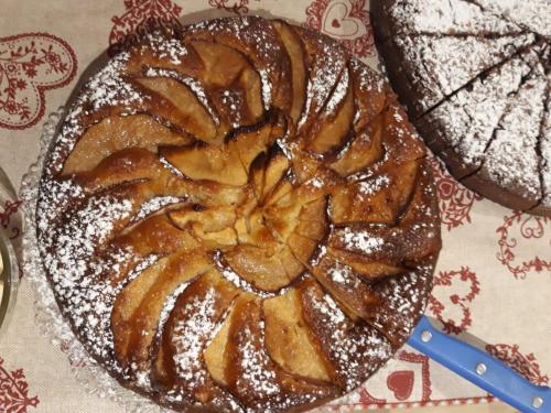 a bundt cake with powdered sugar on a table at Piccola Cesa B&B in Canazei
