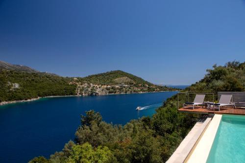 a view of a lake from a house at Villa Anthelia-Idyllic view and private access to the sea in Sivota