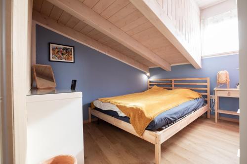 a bedroom with a bed with a wooden headboard at White Tower of Love in Bressanone