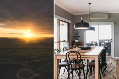 a dining room with a table with chairs and a sunset painting at Milton Woodstock Homestead Luxury retreat with NEW 11M POOL just minutes from the beach in Milton