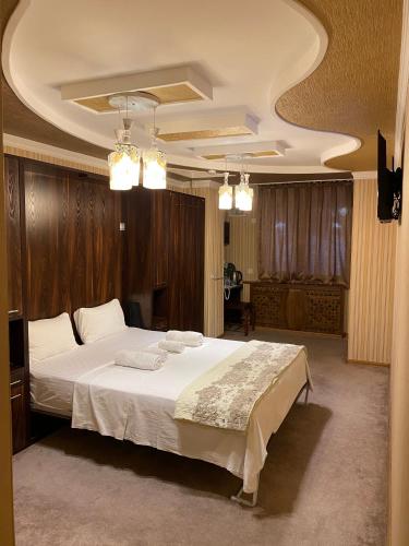 a bedroom with a large bed in a room at BUDGET HOTEL and HOSTEL in Tashkent