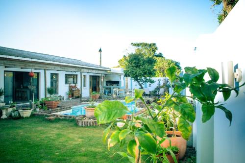 a house with a pool and plants in the yard at Langebaan-On-Sea in Langebaan