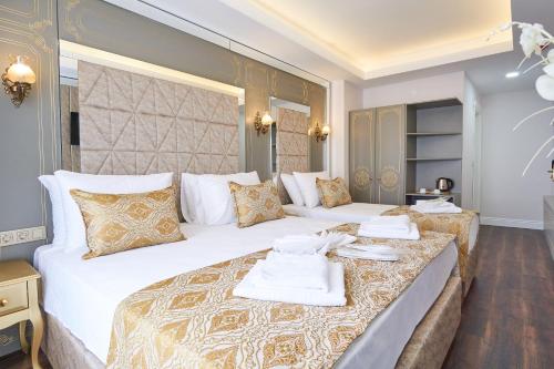 Postel nebo postele na pokoji v ubytování Sultan Suleyman Palace Hotel & Spa
