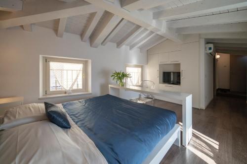 a bedroom with a large bed in a room at Albergo Diffuso Vulcano Village in Castro