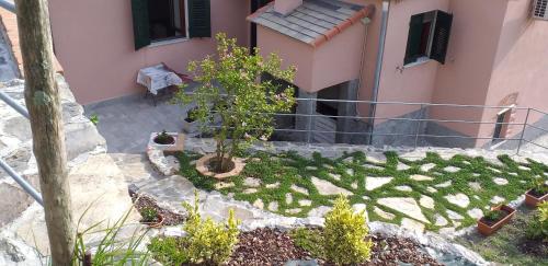 a house with a garden in front of it at La camera del mulino in Levanto