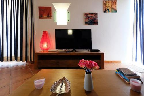 A television and/or entertainment center at LOTUS VILLA, Albufeira