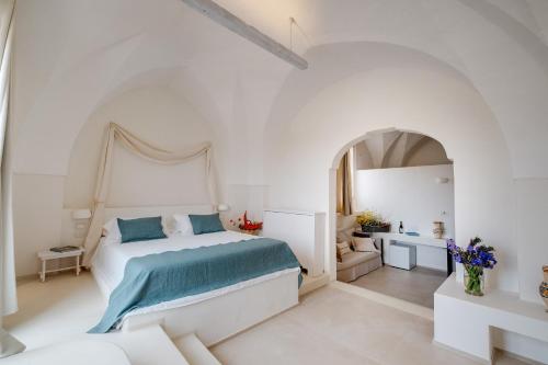 Katil atau katil-katil dalam bilik di Masseria Cuturi