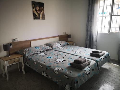 Postel nebo postele na pokoji v ubytování APARTAMENT ORIHUELA COSTA PLAYA FLAMENCA