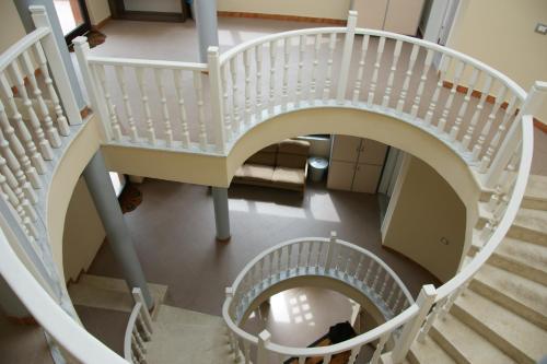 an overhead view of a spiral staircase in a building at The Golden Rooster in Tirana