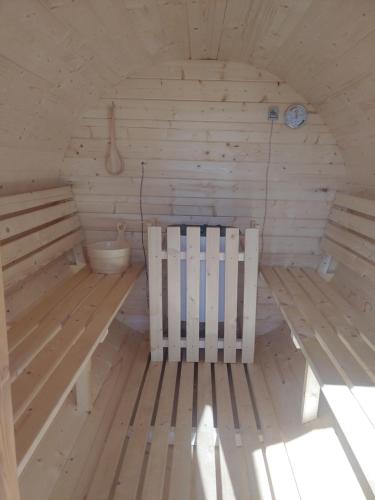 a room with a bench and a toilet in it at Apartamenty przy Jeziorze Żywieckim z widokiem na Skrzyczne in Żywiec