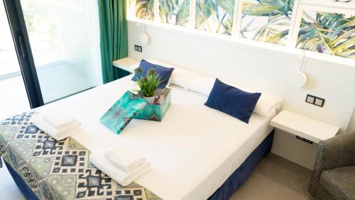 Ein Bett oder Betten in einem Zimmer der Unterkunft Hotel Playa de la Plata