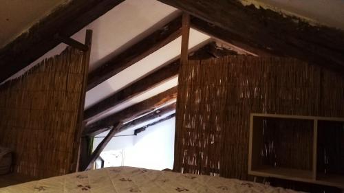 a bedroom with a window and a bed in a room at la feuille de choux ( le MàS du Plot) in Sablières