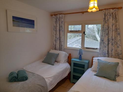 En eller flere senge i et værelse på Blue Skies