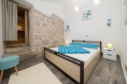 Ένα ή περισσότερα κρεβάτια σε δωμάτιο στο ODISEJA