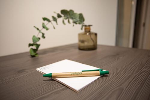 a pen sitting on top of a notebook on a table at Soraluze Hotela in Oñate