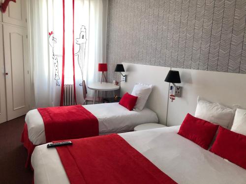 Postel nebo postele na pokoji v ubytování Hôtel Concorde