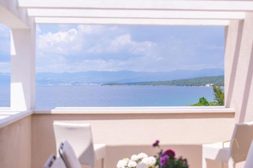a view of the ocean from a window at Luxury Apartments Villa Luce in Malinska