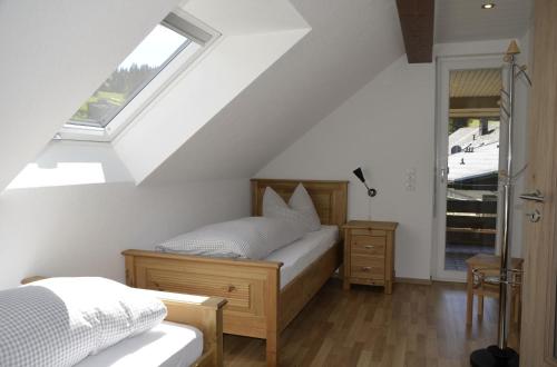 Postel nebo postele na pokoji v ubytování Bergnescht