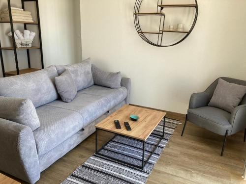 a living room with a couch and a table at Apartments Mrdak in Bar