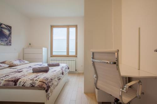 Posteľ alebo postele v izbe v ubytovaní Apartman LAURA