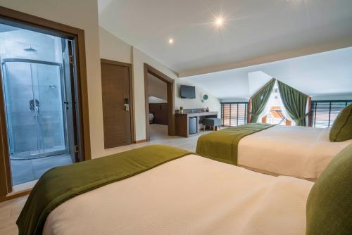 a hotel room with two beds and a large window at WEST HOUSE EXCLUSIVE HOTEL in Göcek