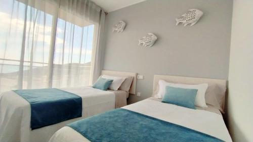 Postel nebo postele na pokoji v ubytování Casa La Xiqueta Playa,160m2,Vistas al mar+WIFI