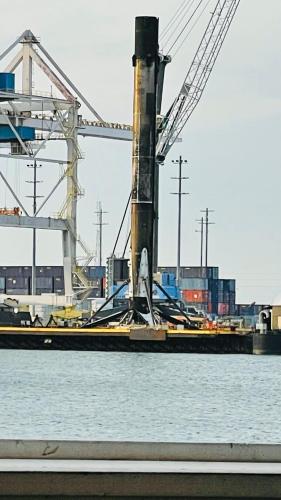 a boat sitting in the water next to a crane at Casa Flamingo in Cape Canaveral