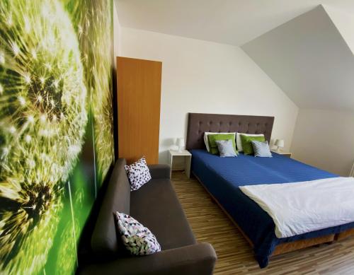 A bed or beds in a room at Bóbita Apartman