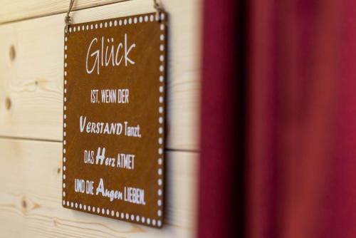 a chalkboard sign hanging on a wall at STAUDACH - Alpinresidenz Zillertal in Ramsau im Zillertal