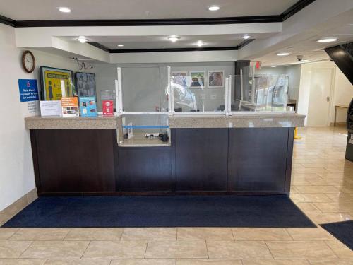 a lobby with a counter in a store at Studio 6 Peoria IL in Peoria