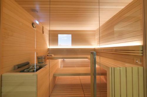 a sauna with wooden walls and a wooden floor at Abbazia Collemedio Resort & Spa in Collazzone