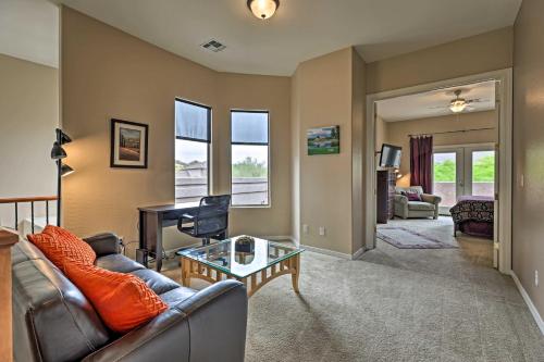 a living room with a couch and a table at Golf Course View and Pool Access Gold Canyon Gem in Gold Canyon