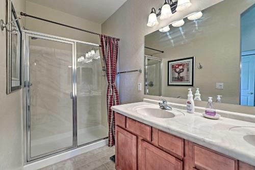 a bathroom with a shower and a sink and a mirror at Golf Course View and Pool Access Gold Canyon Gem in Gold Canyon