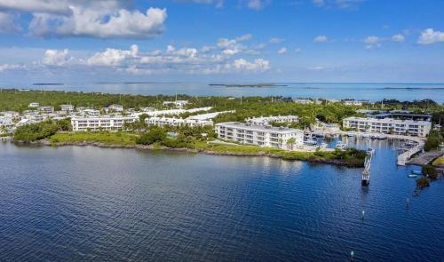 an aerial view of a resort on a body of water at LICENSED Mgr - LUXURY VIP PENTHOUSE SUITE - OFFERS RESORTS BEST PANORAMIC OCEAN VIEWS! in Key Largo