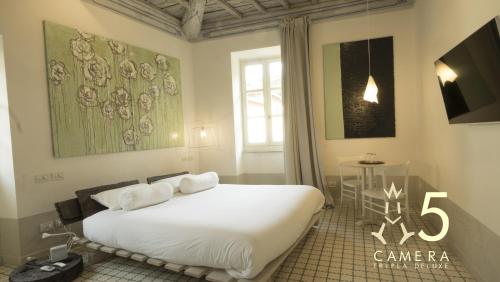 Un ou plusieurs lits dans un hébergement de l'établissement Guest House A Via dei Pellegrini