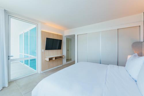 TV a/nebo společenská místnost v ubytování Radisson Blu Aruba