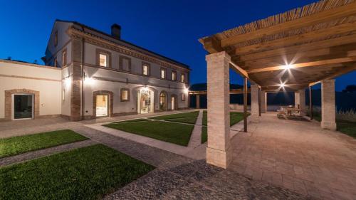 an exterior view of a house with a pavilion at Dimora Montefiore 11, Emma Villas in Montefiore dellʼAso